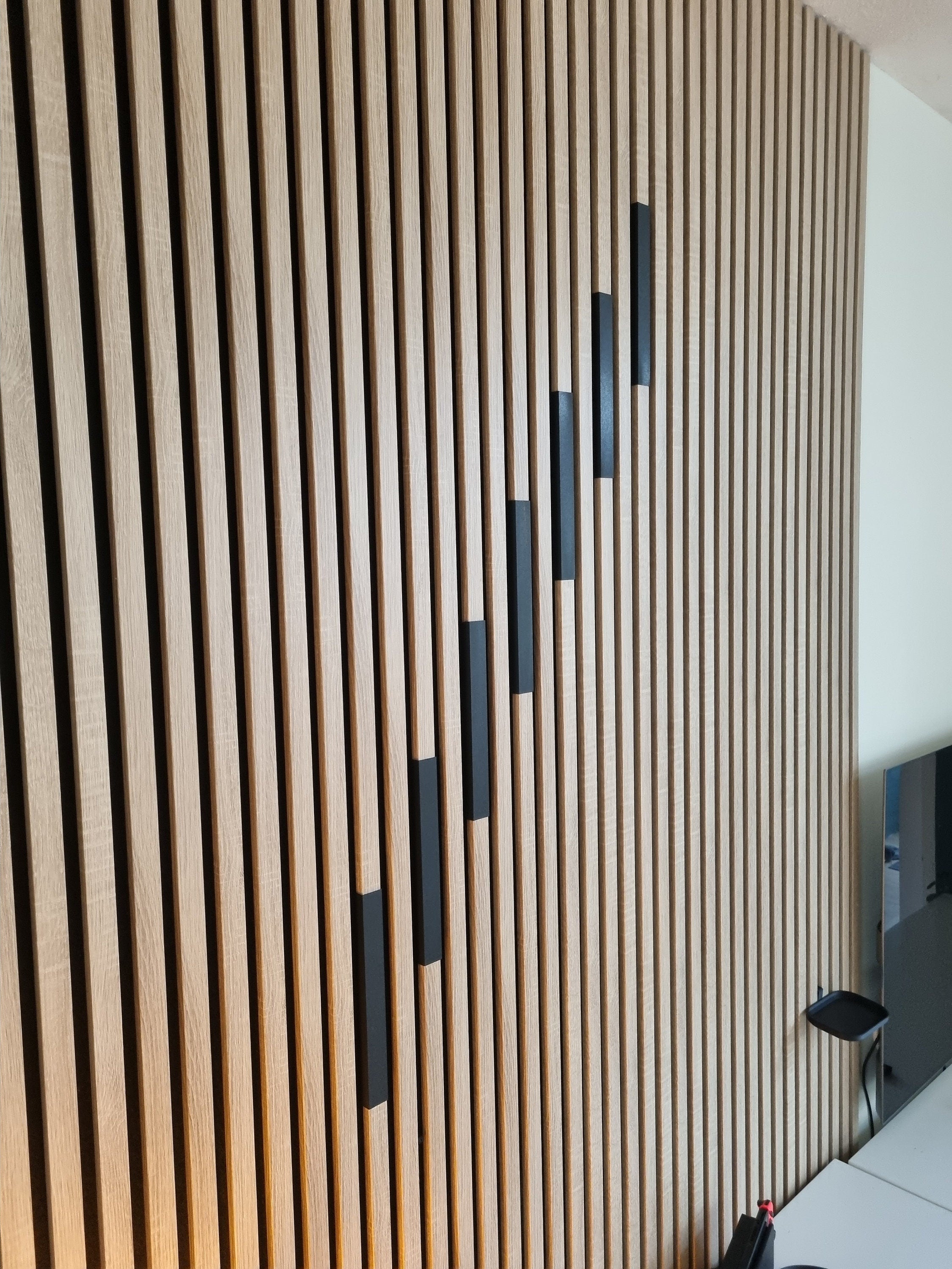 Lamellenafdekkingen voor akoestische panelen